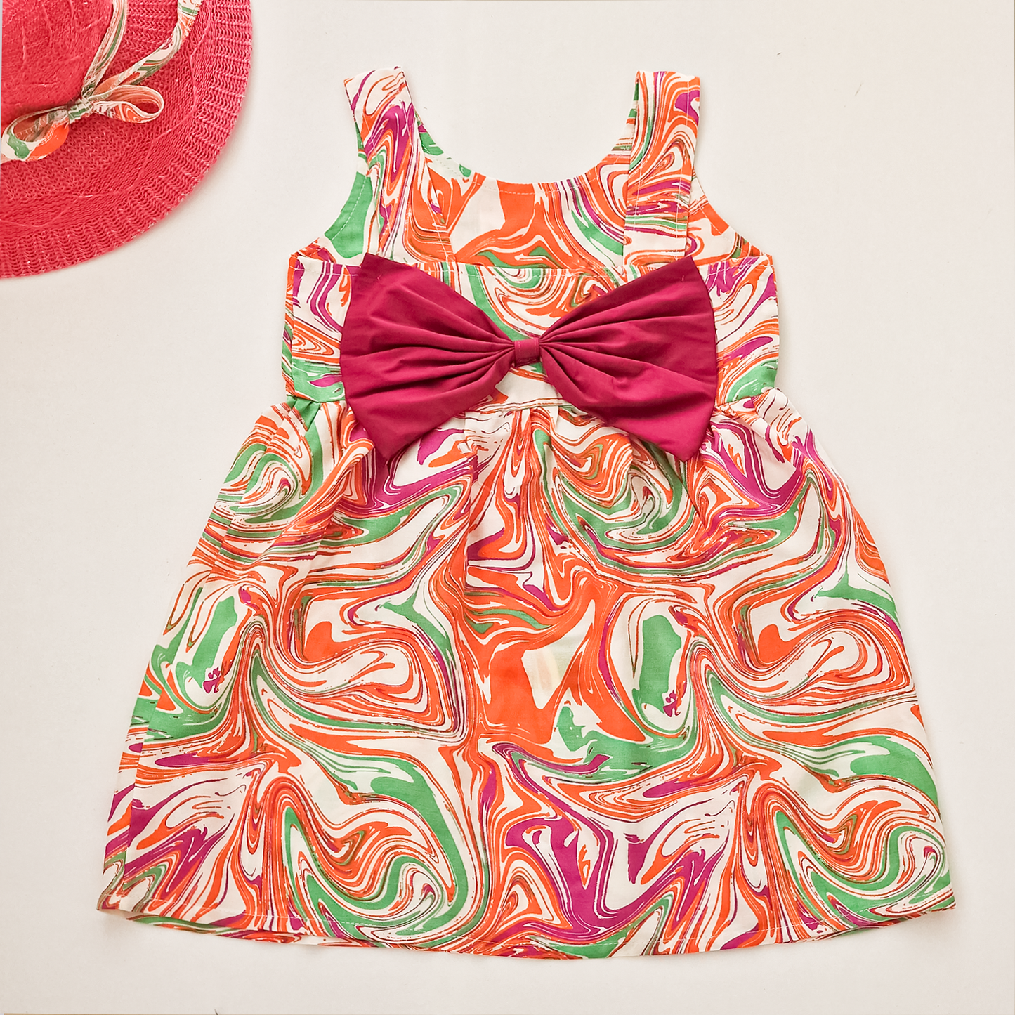 Girls' colorful summer dress with a stylish hat and a bow tie