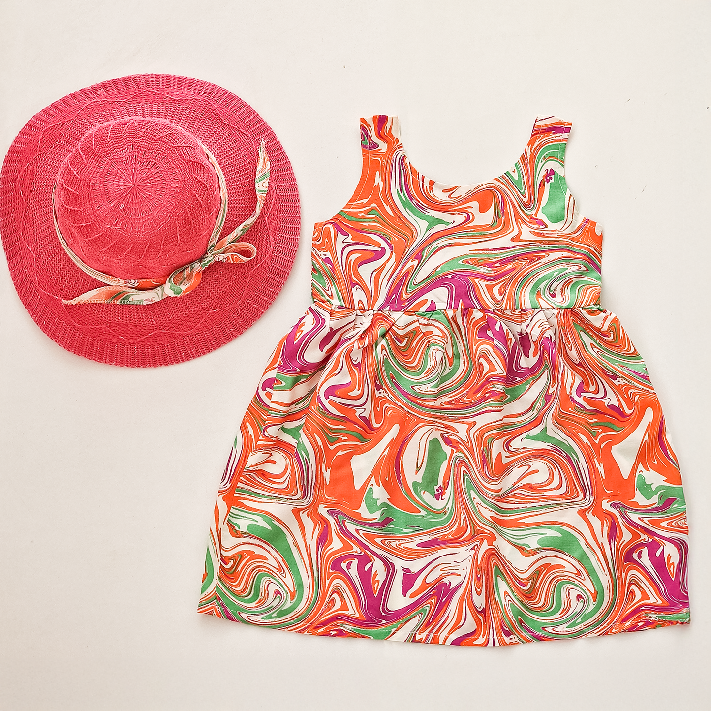 Girls' colorful summer dress with a stylish hat and a bow tie