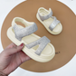 "Fashionable girls' sandals with an elegant shine and comfortable design"