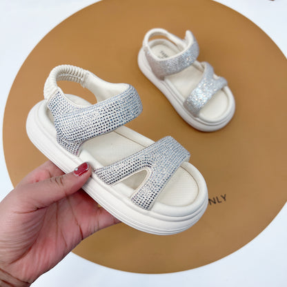 "Fashionable girls' sandals with an elegant shine and comfortable design"