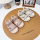 "Fashionable girls' sandals with an elegant shine and comfortable design"