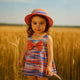 Girls' colorful summer dress with a stylish hat and a large bow tie
