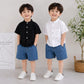 Stylish kids' outfit with a modern design, featuring a button-up shirt and denim shorts – perfect for a comfortable and coordinated look on sunny days!
